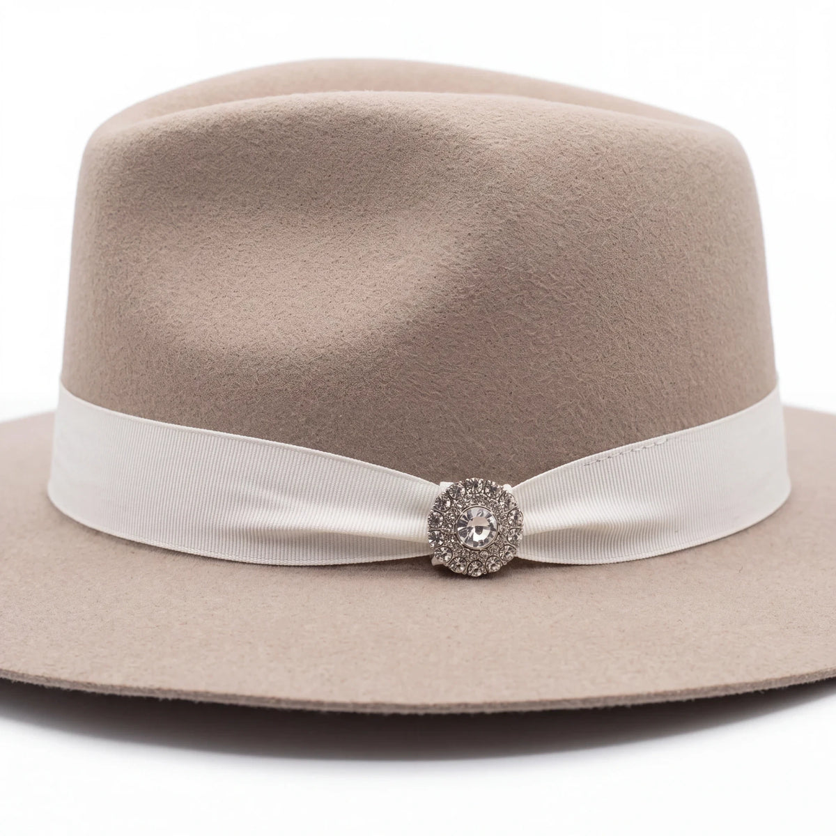 Spirit Warrior Provisions Sofia beige felt hat with a pinch front, white ribbon band, and sparkling sunflower concho.