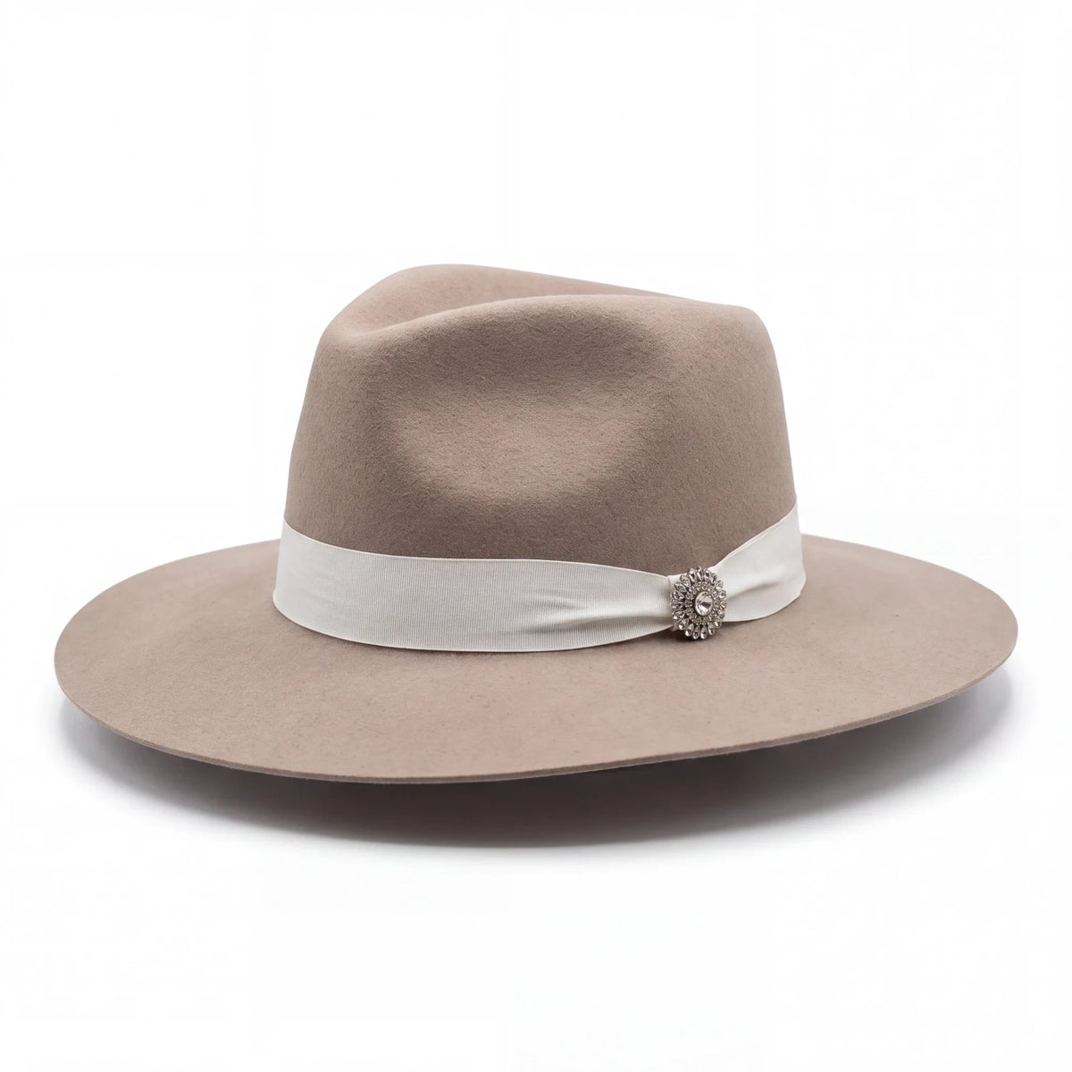 Spirit Warrior Provisions Sofia beige felt hat with a pinch front crown, white ribbon band, and sunflower concho.
