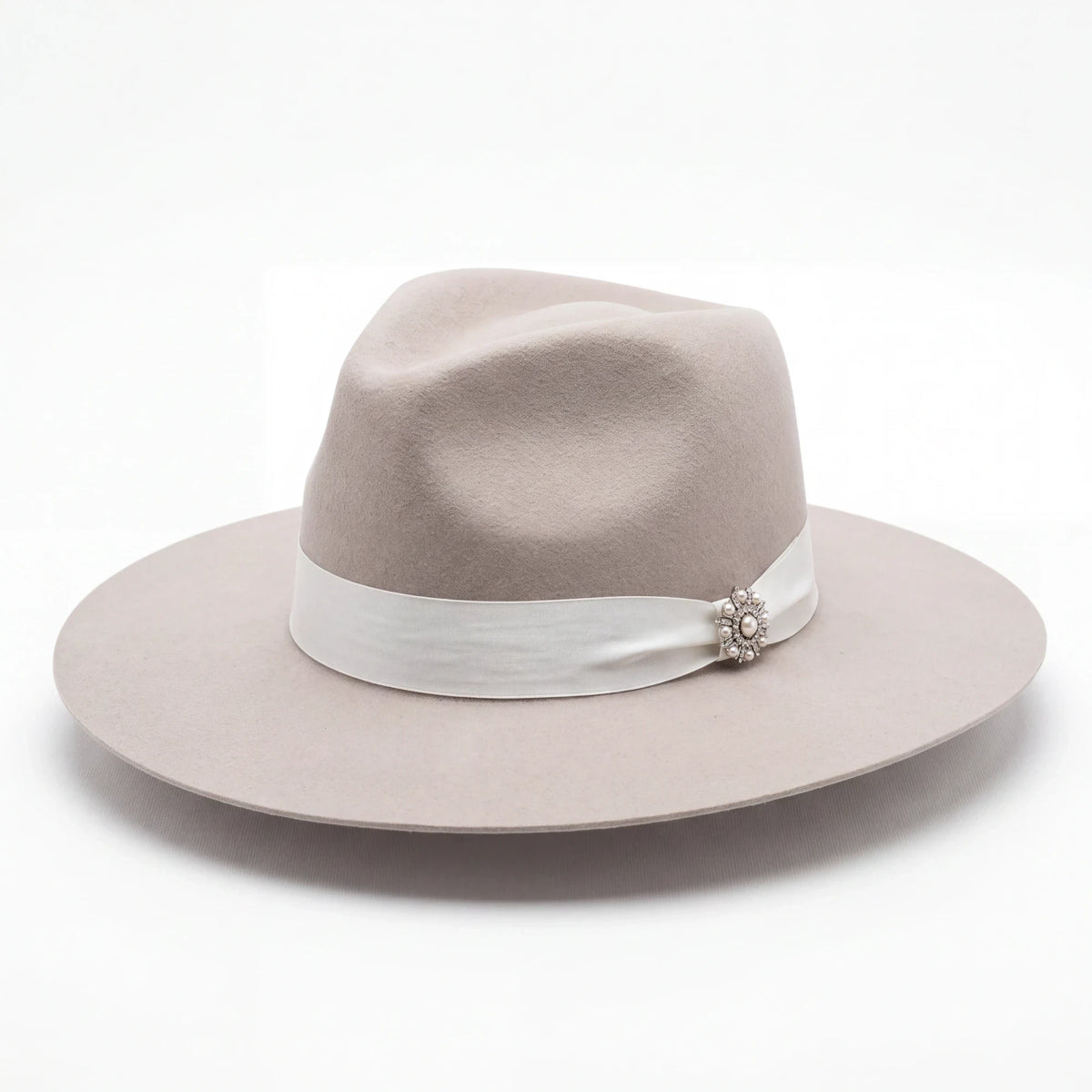Spirit Warrior Provisions Sofia beige felt hat with a pinch front, white ribbon band, and sunflower concho detail.