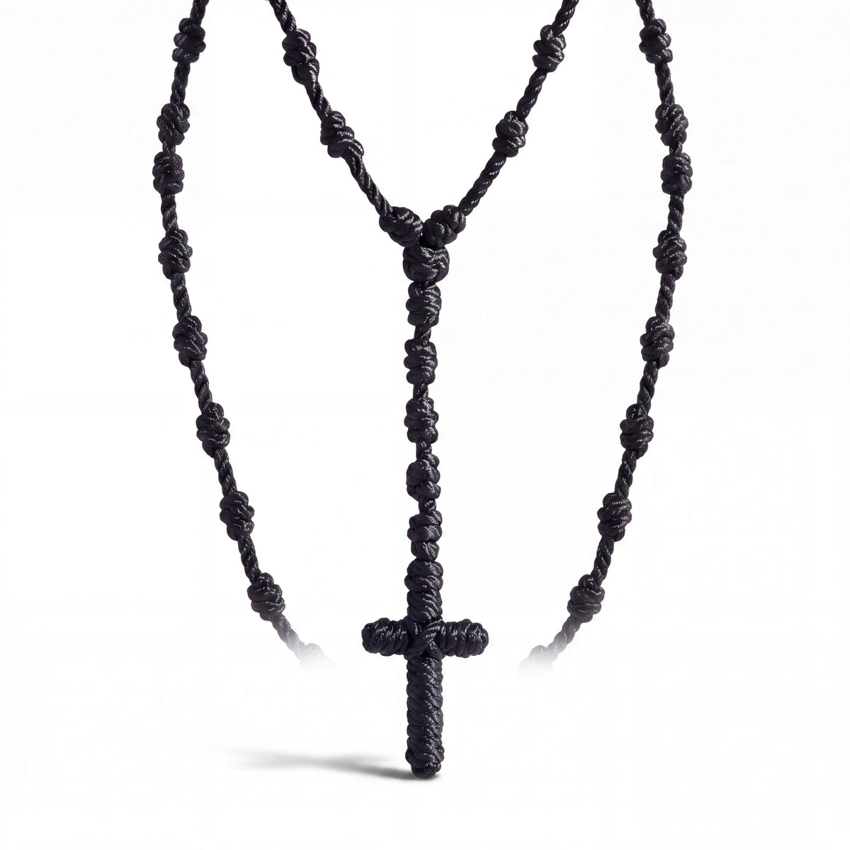 Spirit Warrior Provisions 18-inch black hand-braided rope rosary with a knotted cross for prayer and devotion.