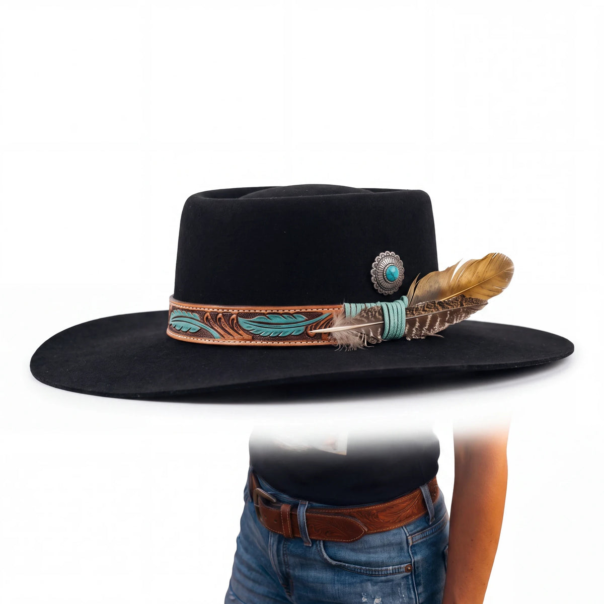 Spirit Warrior Provisions black gambler felt hat with tooled leather band, turquoise concho, and decorative feathers.