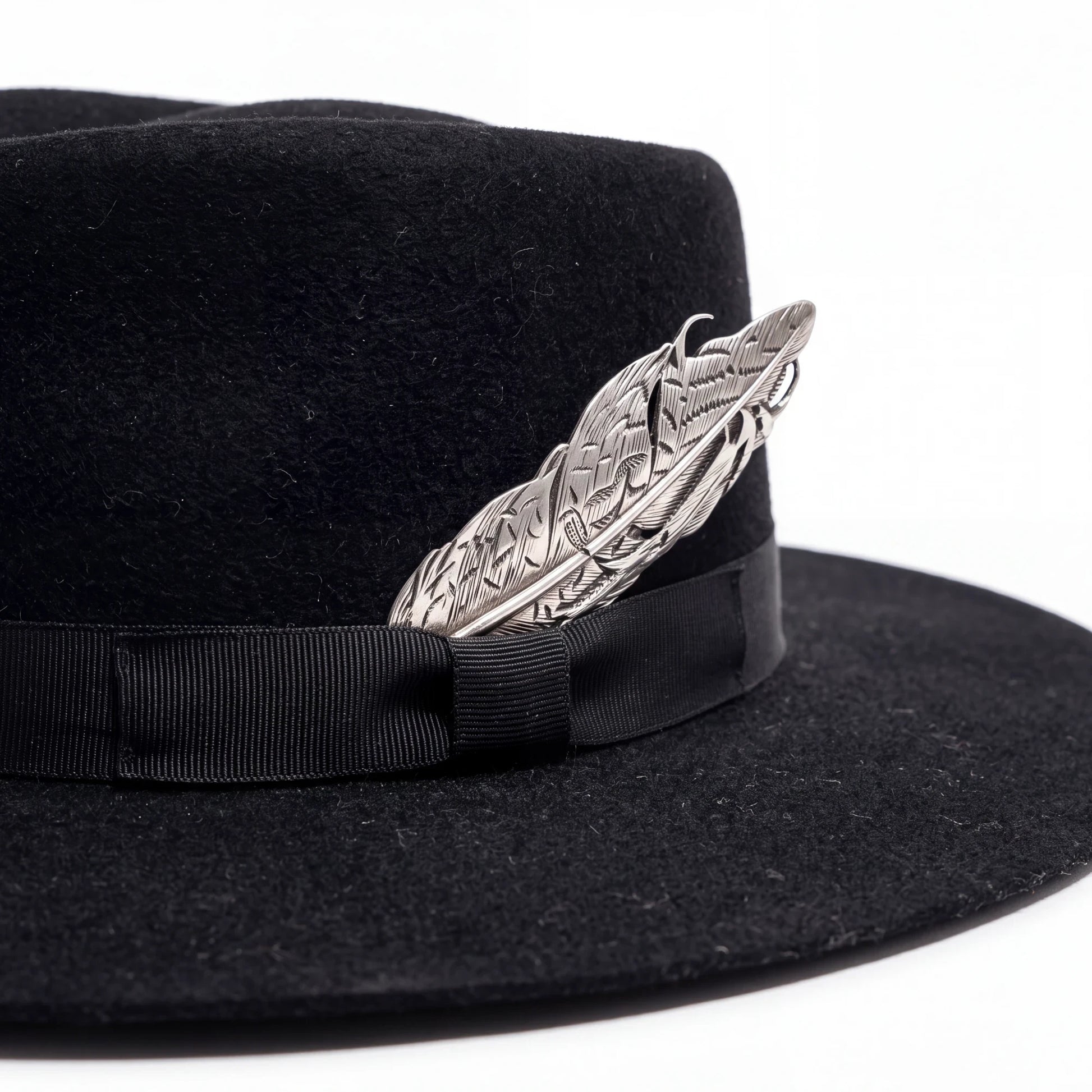 Spirit Warrior Provisions black gambler felt hat featuring a grosgrain ribbon and a polished silver pheasant tail pin.