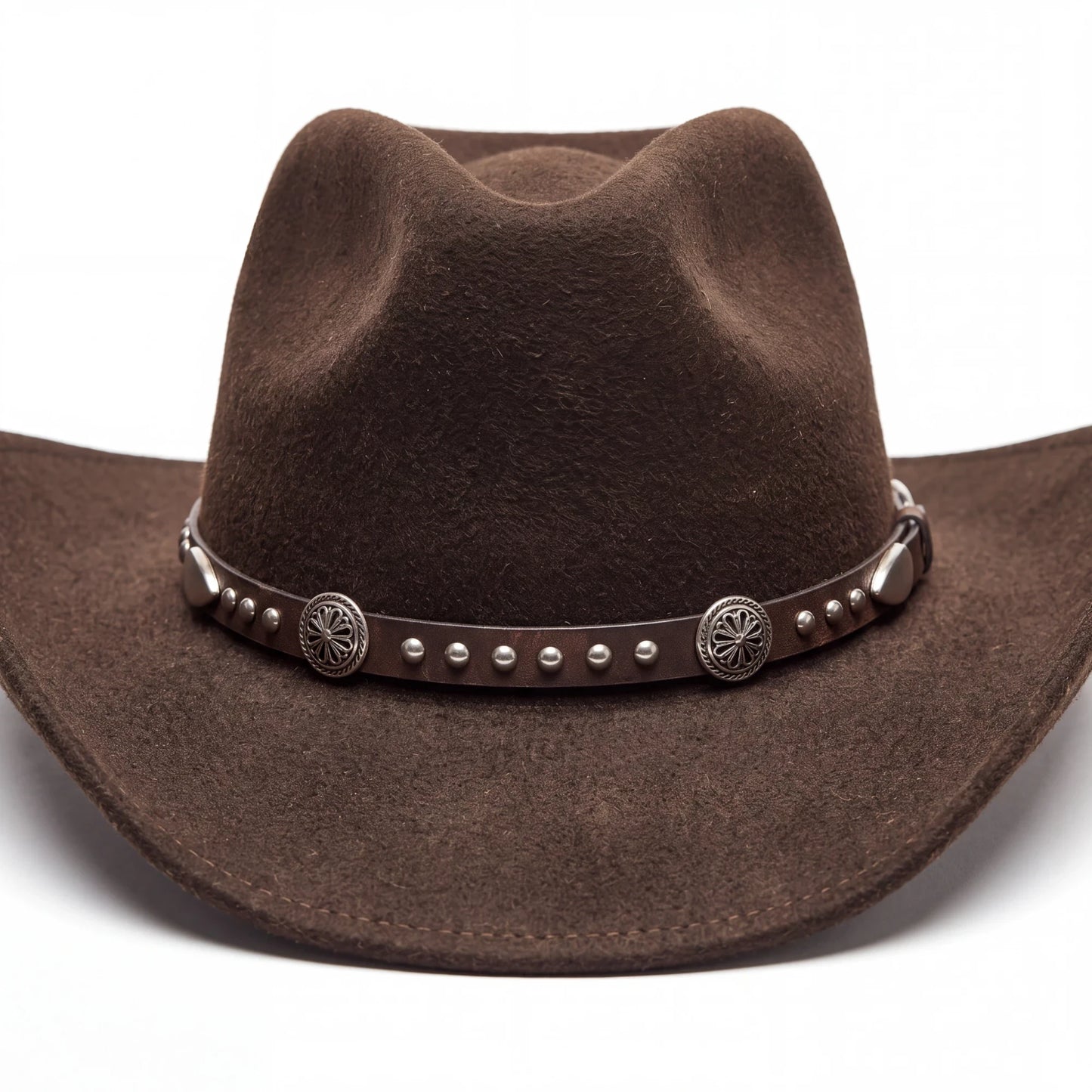 Spirit Warrior Provisions dark brown wool cowboy hat with a leather band featuring silver conchos and studs.