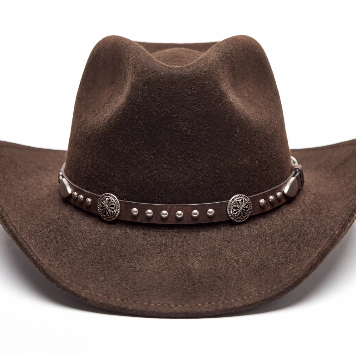 Spirit Warrior Provisions dark brown wool cowboy hat with a leather band featuring silver conchos and studs.