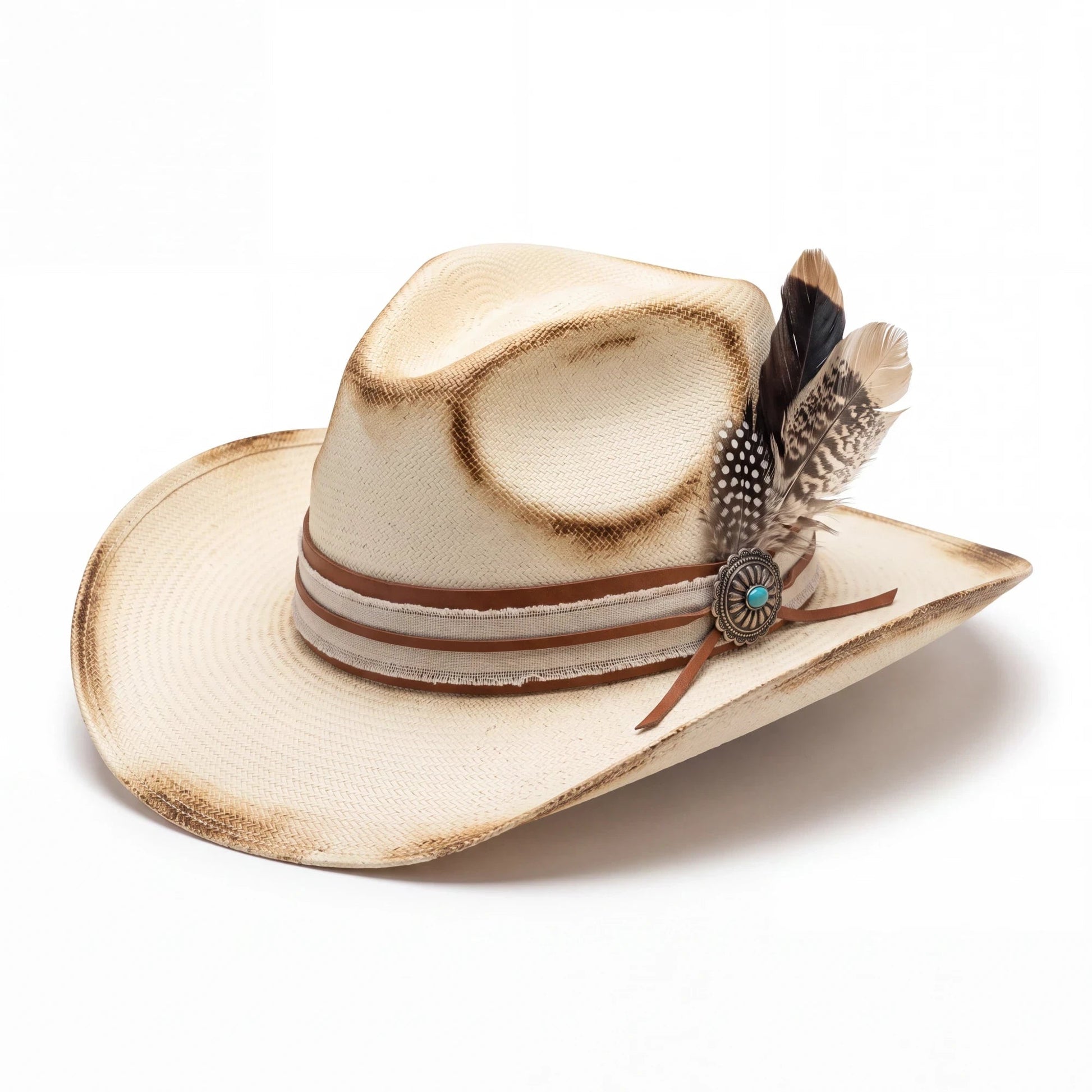 Spirit Warrior Provisions Camino sand felt hat with a pinch front, camel leather band, and tooled concho with feathers.