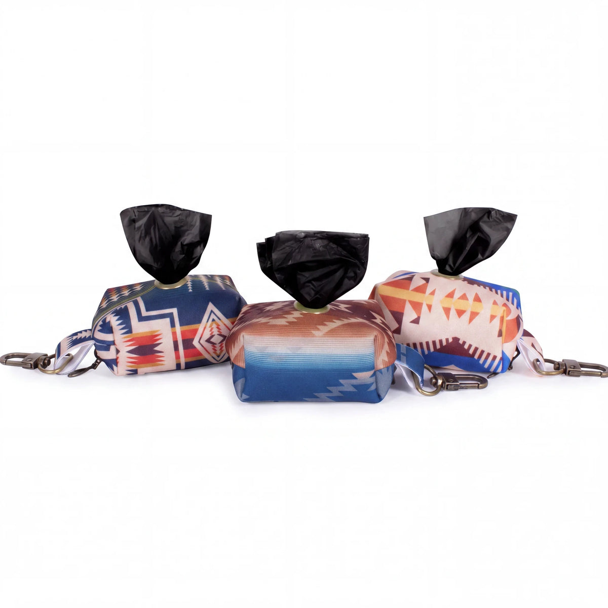 Spirit Warrior Provisions portable dog poop bag dispensers with colorful southwestern geometric patterns and clips