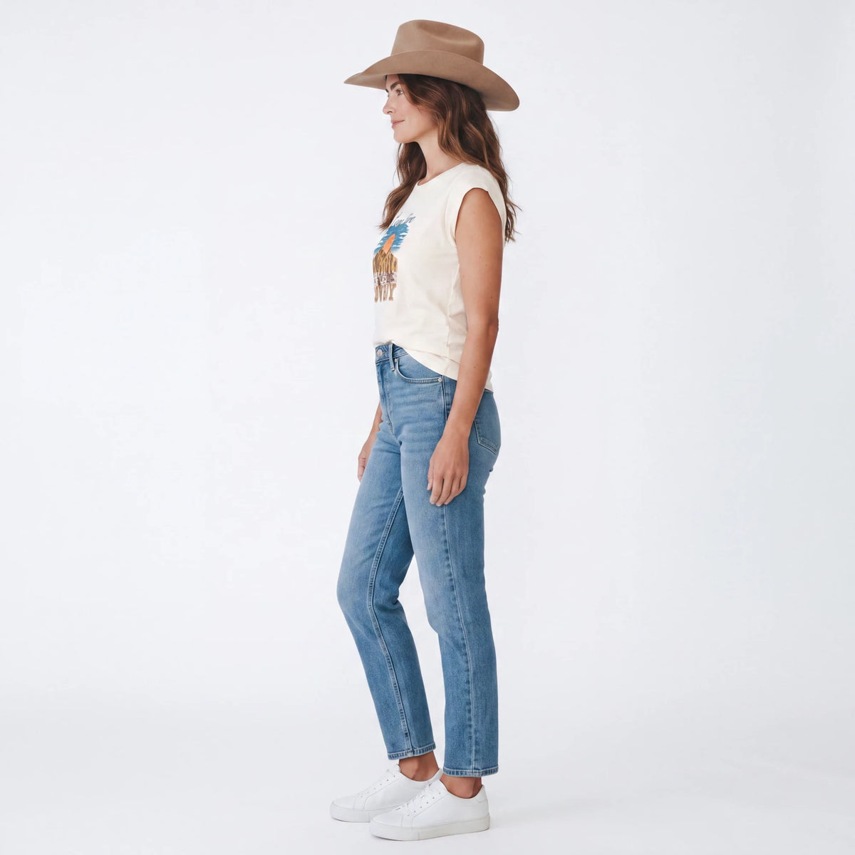 Spirit Warrior Provisions vintage-style cream graphic t-shirt with rodeo desert print worn with jeans and a hat